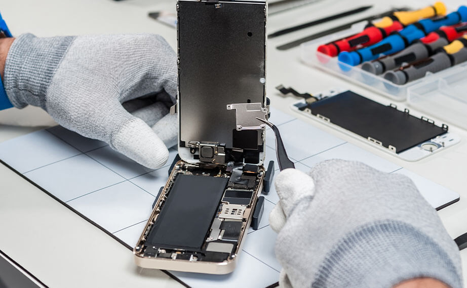 close up of technician completing a phone repair