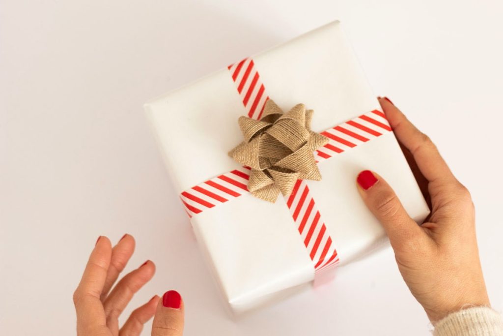 close-up of woman holding christmas gift