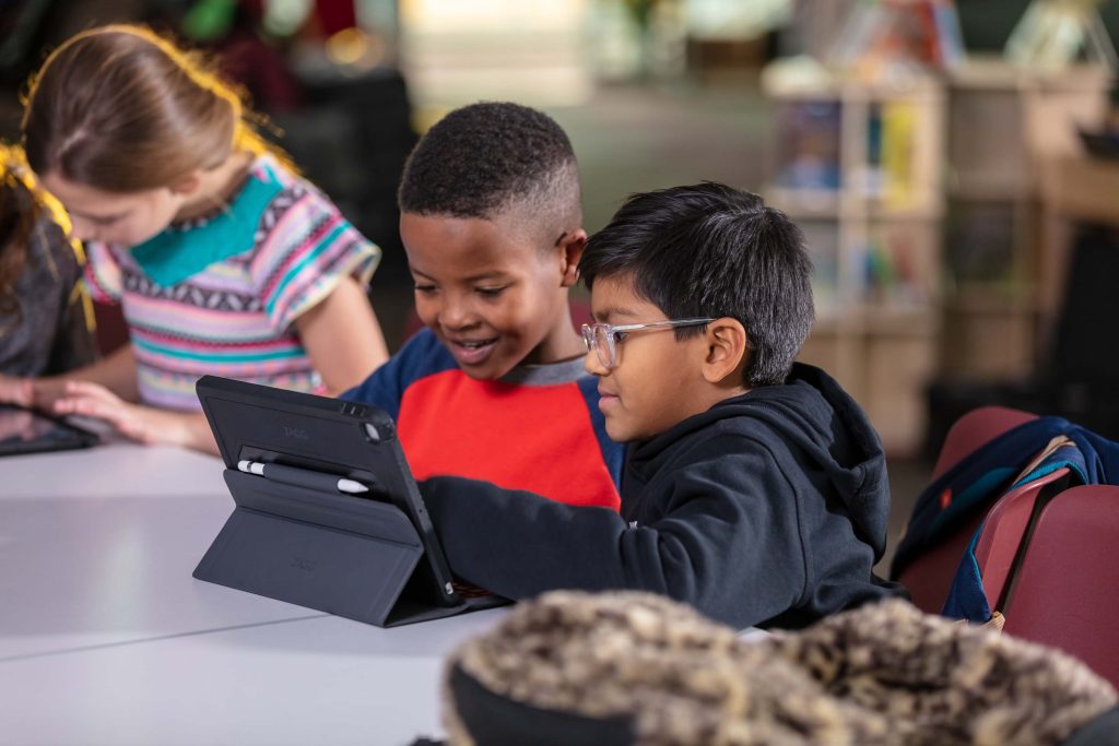 two young kids on tablet