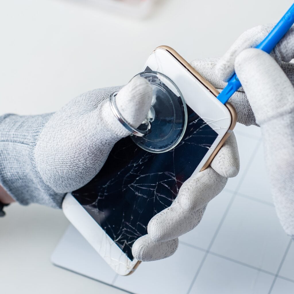 repair tech fixing iphone water damage